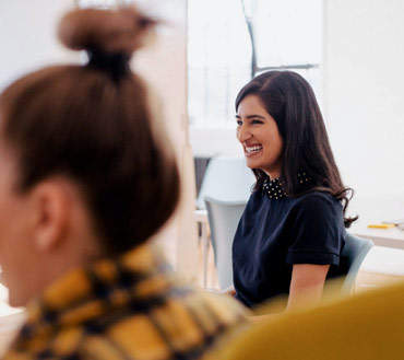 Lady candidate smiling in workplace.